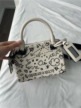 Charles & Keith Cream Top Handle Mini Bag with Black Doodle Print